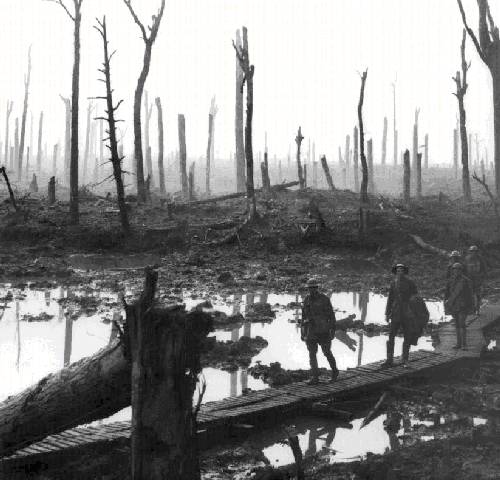 Australian gunners on a duckboard track in Château Wood near Hooge, close to Passchendaele, 29 October 1917. Photo by Frank Hurley.